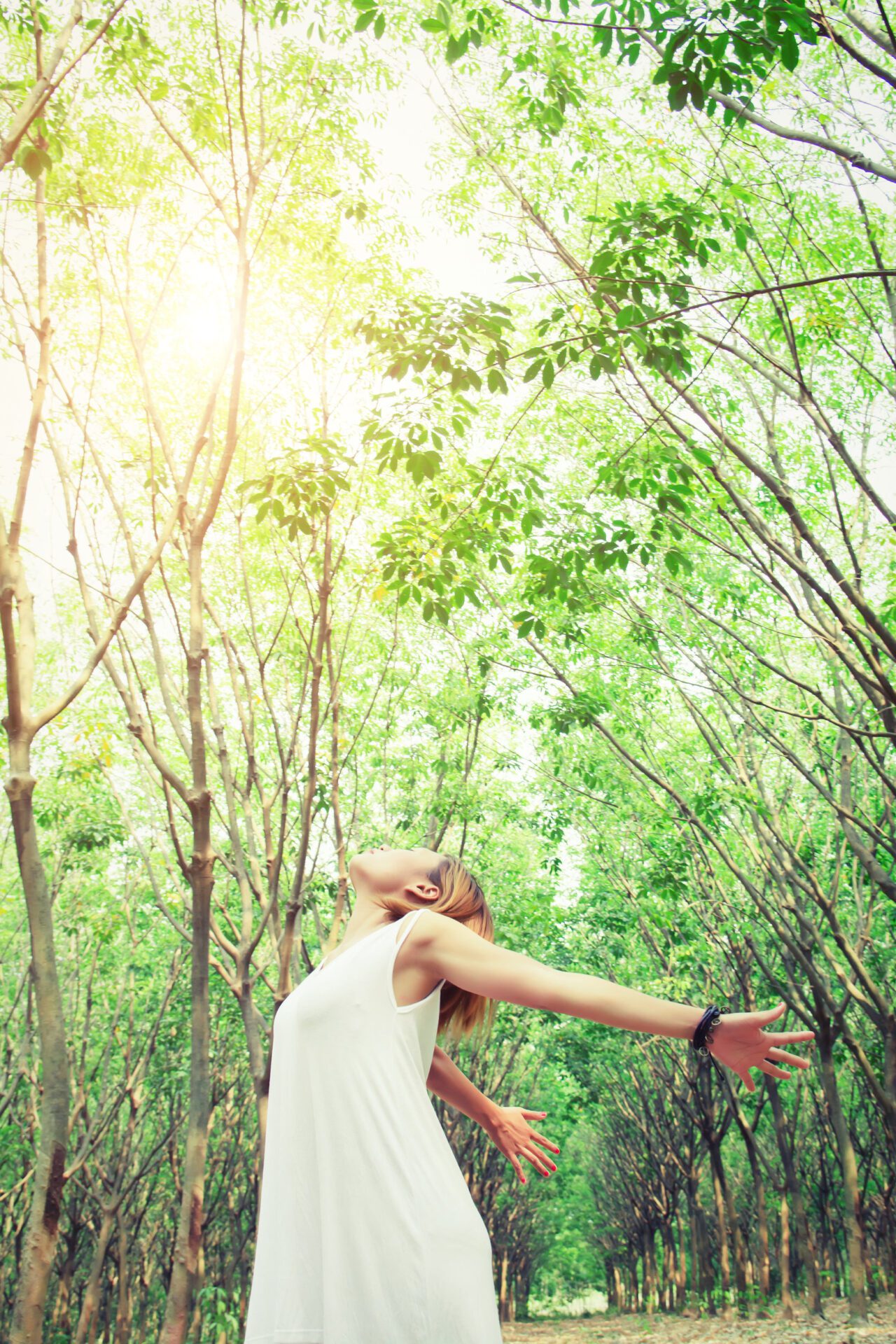 women lifestyle concept : young asian woman stretch her hands in Clean Energy